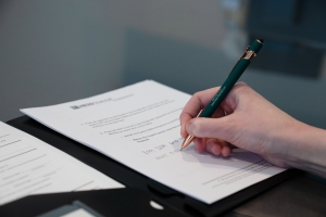 taking notes during meeting with financial planner about taxes and donor advised funds