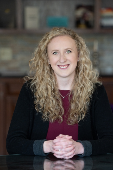 SKG-23 conf table hands SKG hands crossed conf room